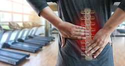 Young man Feeling suffering Lower back pain